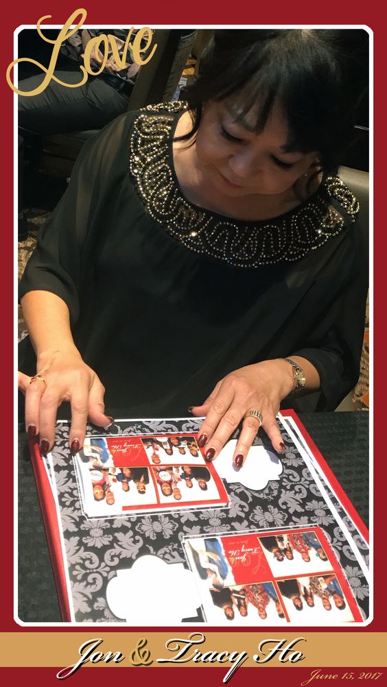 Woman signing a photo album