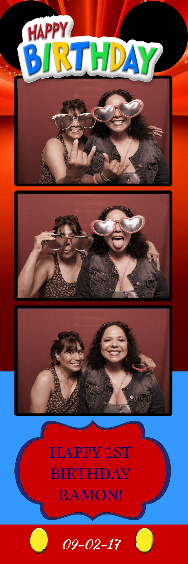 Two women with sunglass props posing in front of backdrop