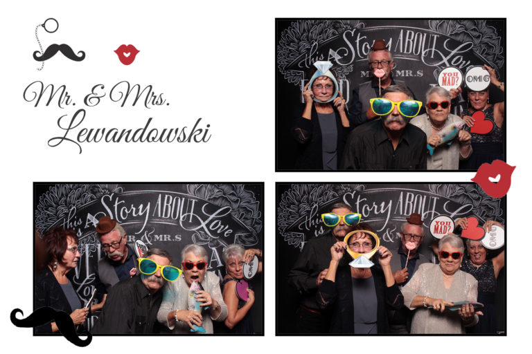 4x6 photo strip of group posing with chalkboard backdrop