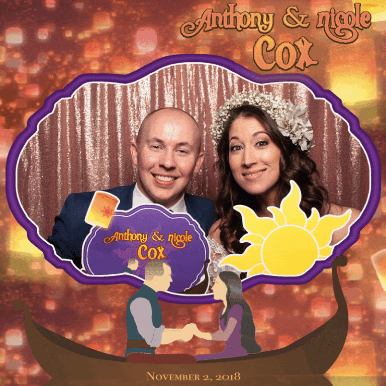 Couple with custom props posing in front of shiny backdrop