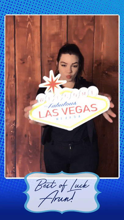 moving gif with Vegas sign in front of wood fence backdrop