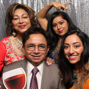 group pose with backdrop and giant wine prop Photo Booth Rentals in Las Vegas Smash Booth