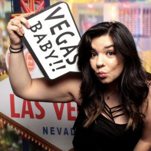 woman posing with Vegas strip backdrop and sign prop Photo Booth Rentals in Las Vegas Smash Booth