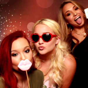 three women posing with backdrop and props Photo Booth Rentals in Las Vegas Smash Booth