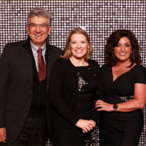 group pose with silver shimmer backdrop Photo Booth Rentals in Las Vegas Smash Booth