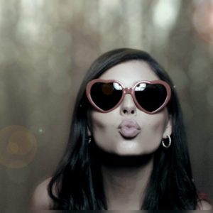 woman making kissing face posing with sunglasses Photo Booth Rentals in Las Vegas Smash Booth