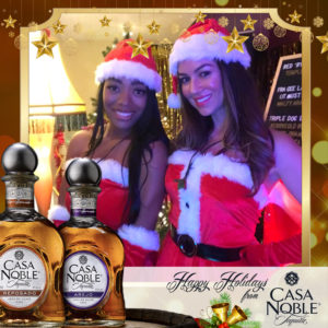 casa noble tequila Christmas two women posing Photo Booth Rentals in Las Vegas Smash Booth