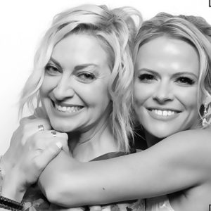 black and white image of two women hugging Photo Booth Rentals in Las Vegas Smash Booth