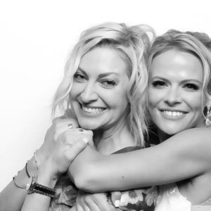 black and white image of two women hugging Photo Booth Rentals in Las Vegas Smash Booth