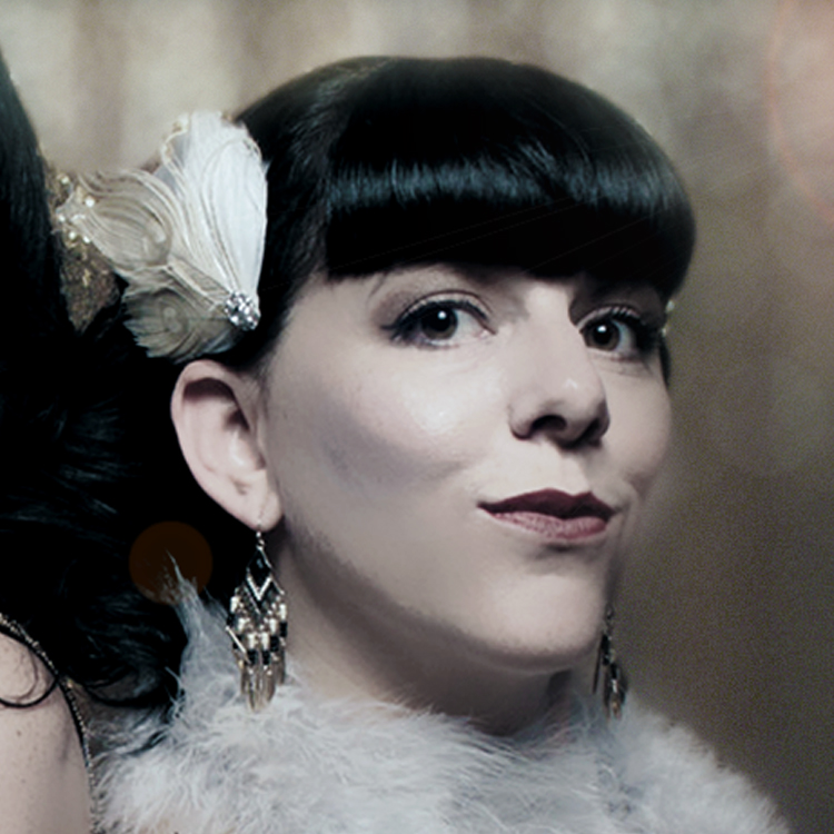 vintage-style-black-and-white-portrait-of-woman-with-bangs-and-earrings