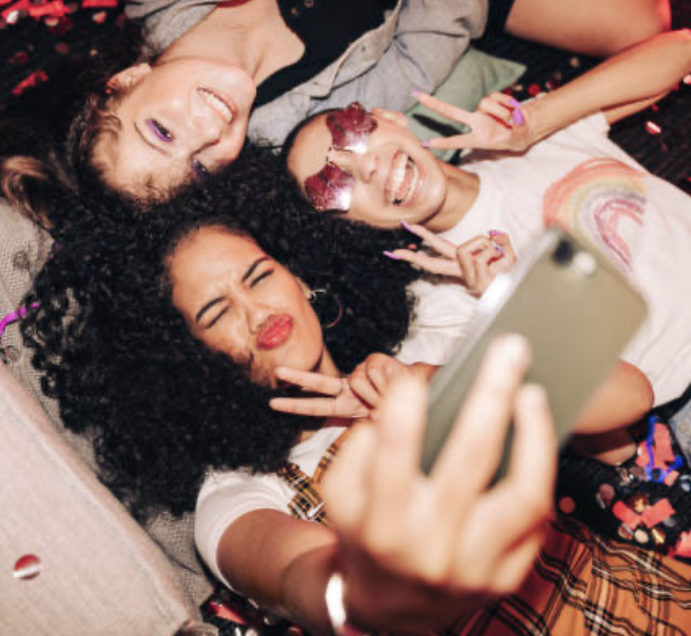 group-of-friends-taking-selfies-while-laying-on-floor-at-las-vegas-photo-booth