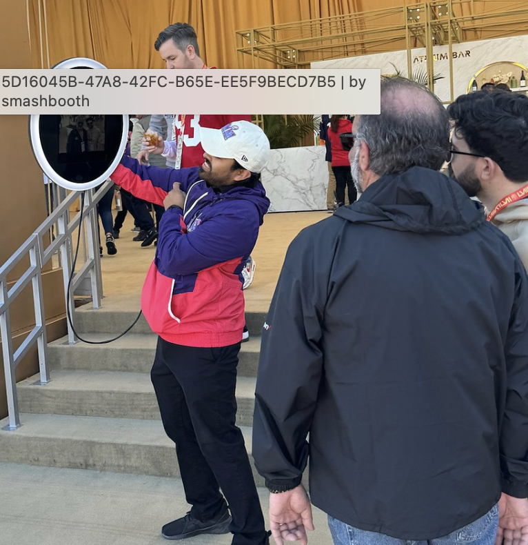 man-in-santa-hat-with-event-staff-on-stairs