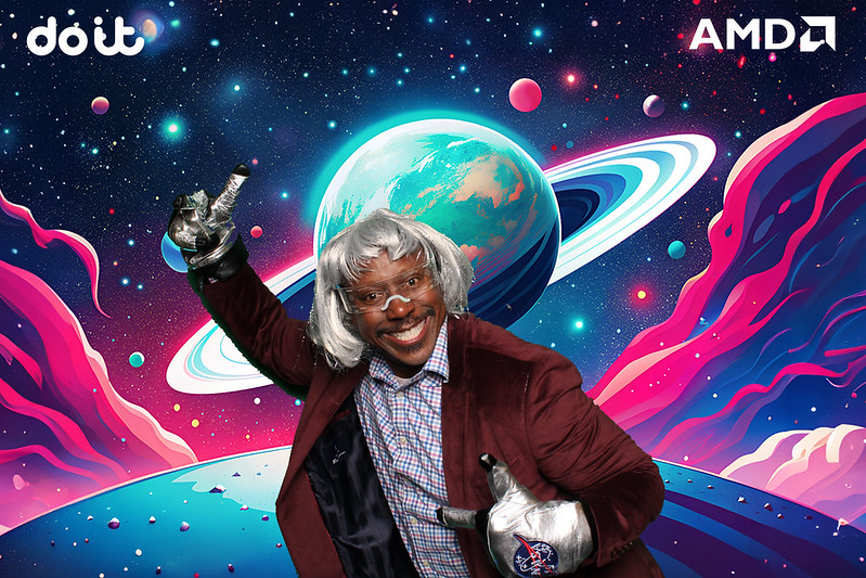 Event-guest-posing-in-galaxy-themed-green-screen-background-with-AMD-and-Dolby-branding-at-corporate-activation