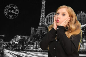 Guest-posing-with-black-and-white-Paris-green-screen-backdrop-at-themed-photo-booth-experience-in-Las-Vegas
