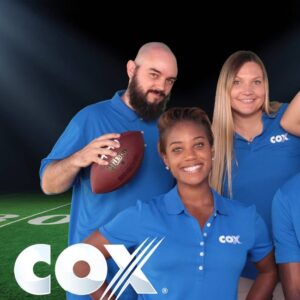 Team-members-posing-at-branded-photo-booth-with-custom-green-screen-background-for-Cox-Communications-corporate-event