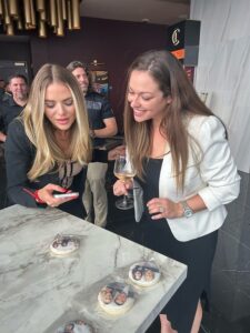 two-women-interacting-with-interactive-photo-tabletop-display