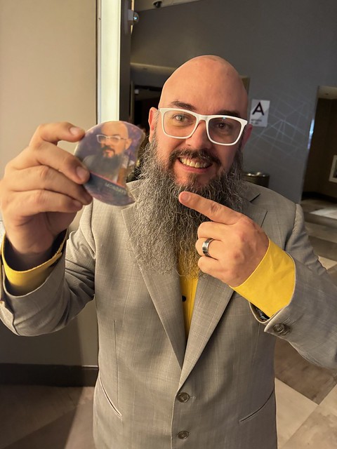 man-smiling-holding-cookie-with-photo-print