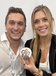 man-and-woman-smiling-holding-cookie-photo-print