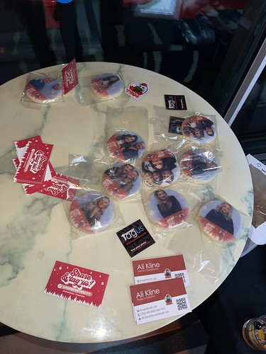 table-with-wrapped-cookie-photo-prints-and-promo-cards