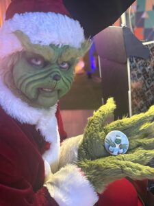 person-in-grinch-costume-at-holiday-photo-booth