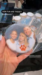 hand-holding-cookie-with-printed-photo-and-paw-logo
