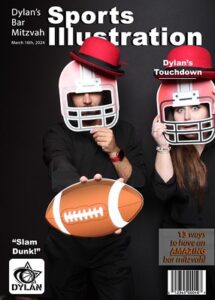 two-people-posing-with-football-props-in-smash-booth-sports-themed-photo-booth