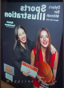 two-women-posing-in-front-of-wipa-las-vegas-award-backdrop-at-smash-booth-event