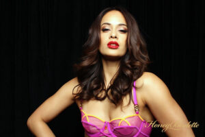 woman-in-purple-top-with-dark-hair-smiling