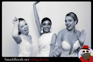 black-and-white-photo-of-three-women-in-white-dresses