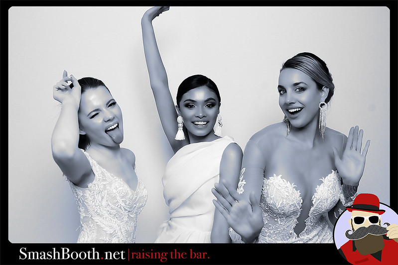 black-and-white-photo-of-three-women-in-white-dresses