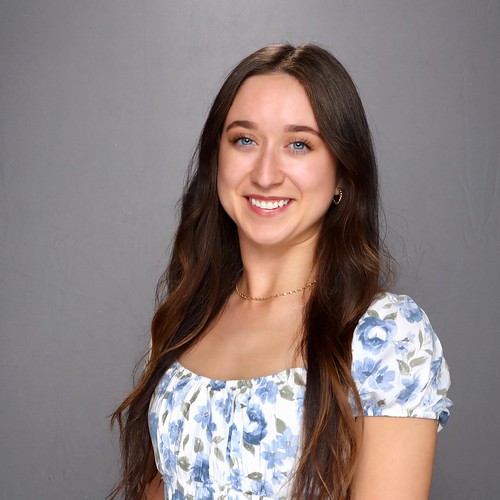 woman-in-blue-and-white-floral-dress