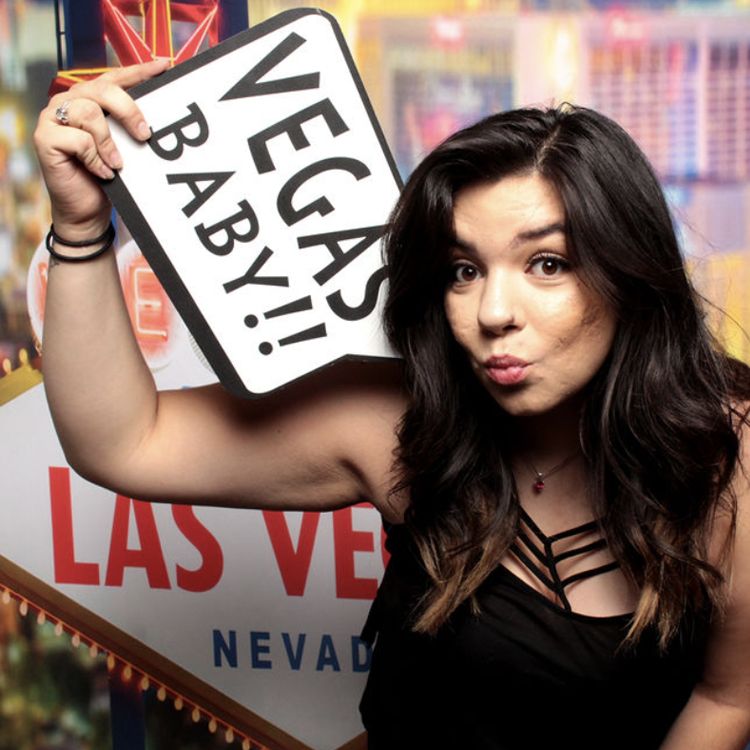 woman-holding-vegas-baby-sign-with-playful-expression-at-smash-booth-las-vegas