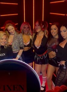 group-of-friends-posing-inside-smash-booth-photo-booth-with-light-effects