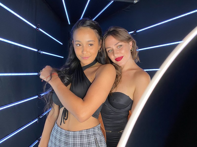two-women-smiling-in-smash-booth-photo-booth-with-black-and-white-backdrop