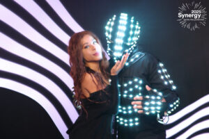 woman-singing-into-microphone-at-smash-booth-led-stage-setup