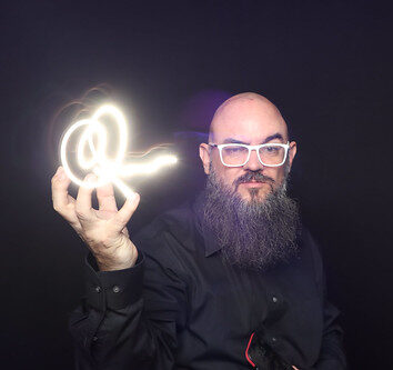 man-holding-glowing-light-swirl-in-smash-booth-light-painting-photo-booth