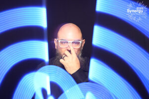 man-posing-with-blue-light-streak-backdrop-at-smash-booth