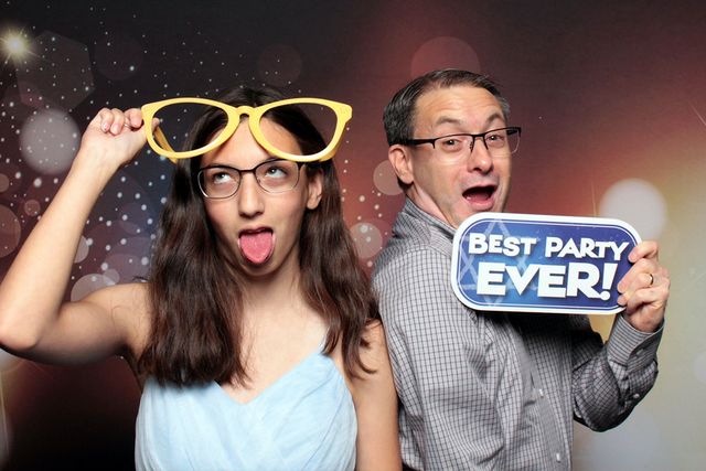 man-and-woman-wearing-funny-glasses-at-smash-booth-las-vegas