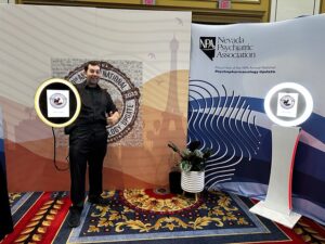 man-posing-in-front-of-custom-event-backdrop-at-smash-booth-photo-booth