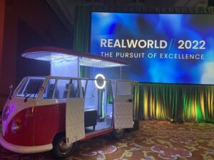 vw-bus-photo-booth-at-corporate-event-with-realworld-2023-banner