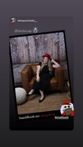 woman-in-black-pants-and-red-hat-posing-in-smash-booth-action-shot