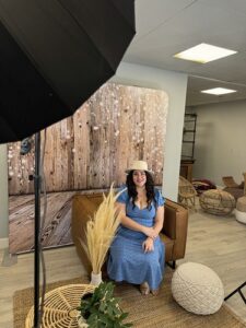 smash-booth-photo-shoot-with-woman-in-blue-dress-and-floral-arrangements