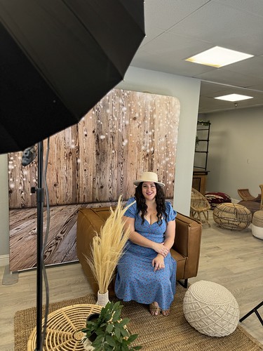 smash-booth-photo-shoot-with-woman-in-blue-dress-and-floral-arrangements