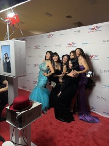 group-of-six-woman-posing-in-front-of-smash-booth-photo-booth