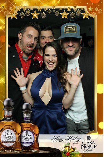 three-friends-in-formal-attire-posing-on-stage-at-smash-booth-las-vegas
