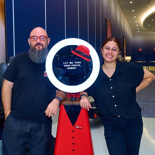 man-and-woman-posing-with-photo-booth-ring-light
