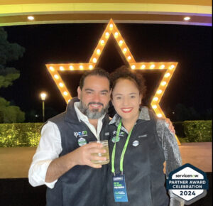 man-and-woman-smiling-in-front-of-star-light-display