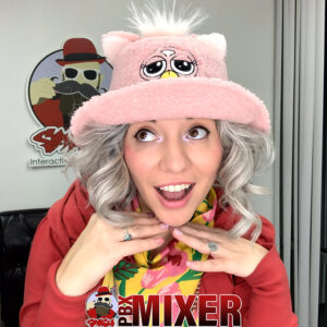 Woman-wearing-pink-cat-hat-and-making-fun-expression-at-photo-booth-with-MIXET-logo
