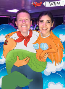 Cartoon-style-green-screen-photo-booth-image-featuring-two-guests-and-clouds