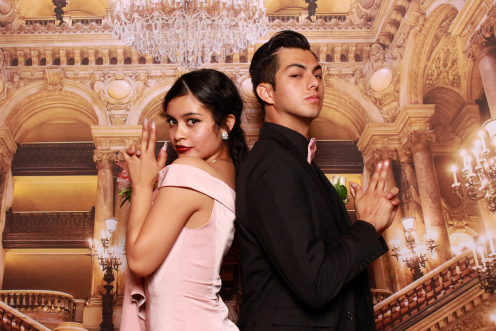 couple-posing-back-to-back-in-photo-booth